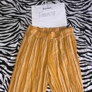 Never worn yellow flare pants.